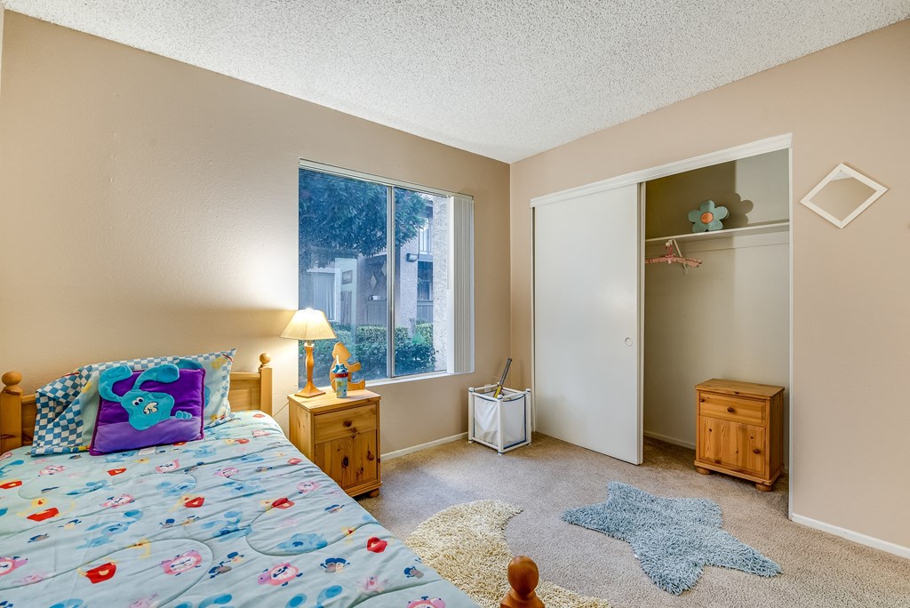 a bedroom with a bed and two night stands