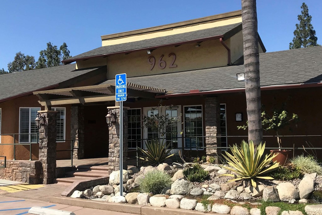a building with a street sign in front of it