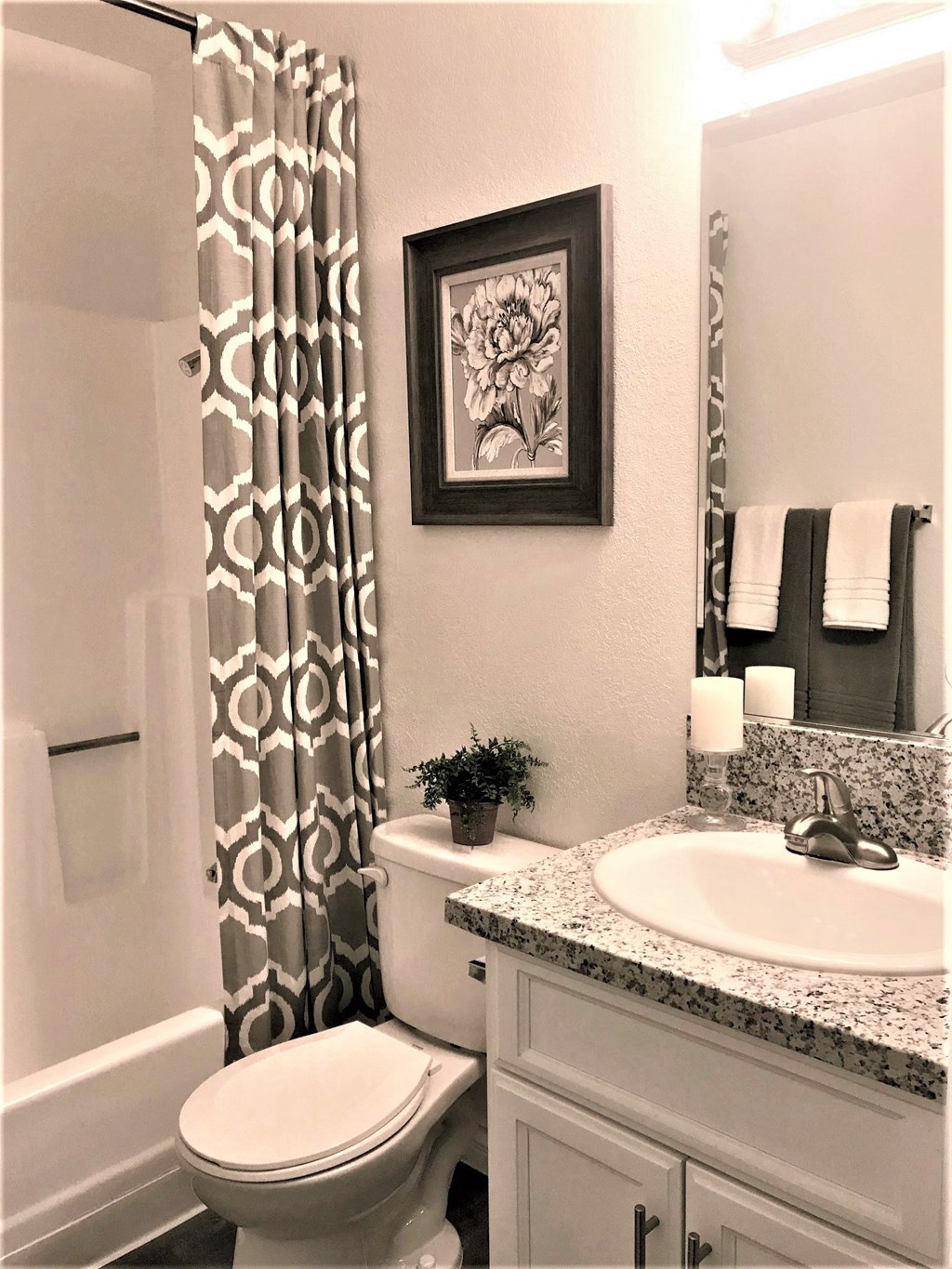 a bathroom with a toilet sink and shower