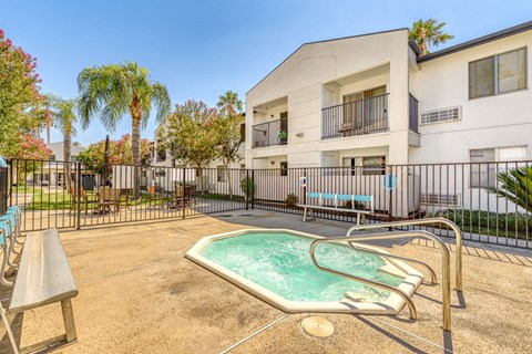 our apartments have a private hot tub and a patio with tables
