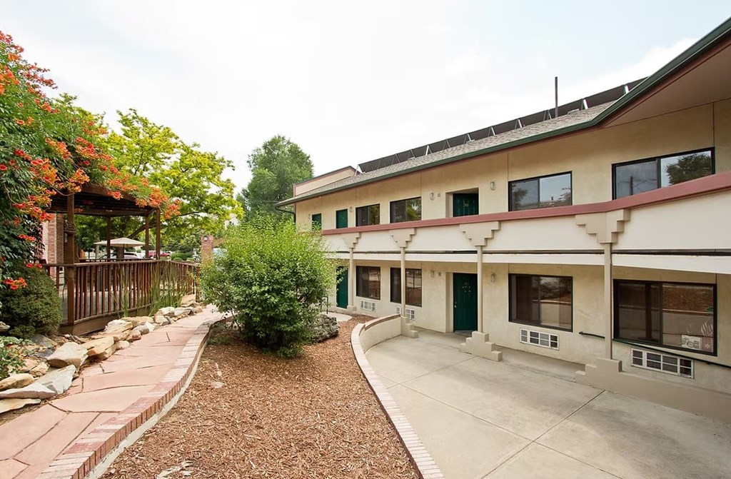 A building with a red roof and a green door.