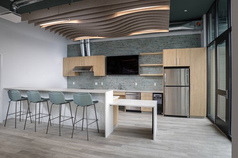 a kitchen and dining area with a table and chairs
