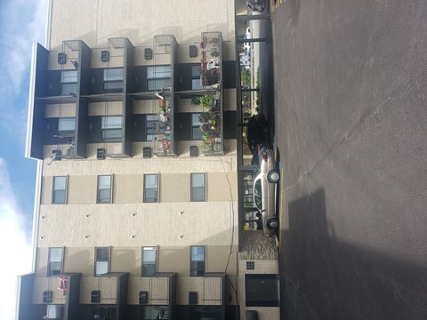 A building with a grey wall on the right side.