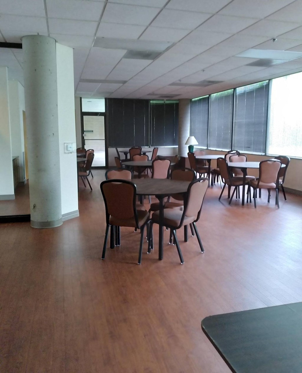 a large room with tables and chairs