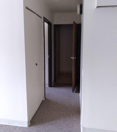 a view of the hallway from the living room