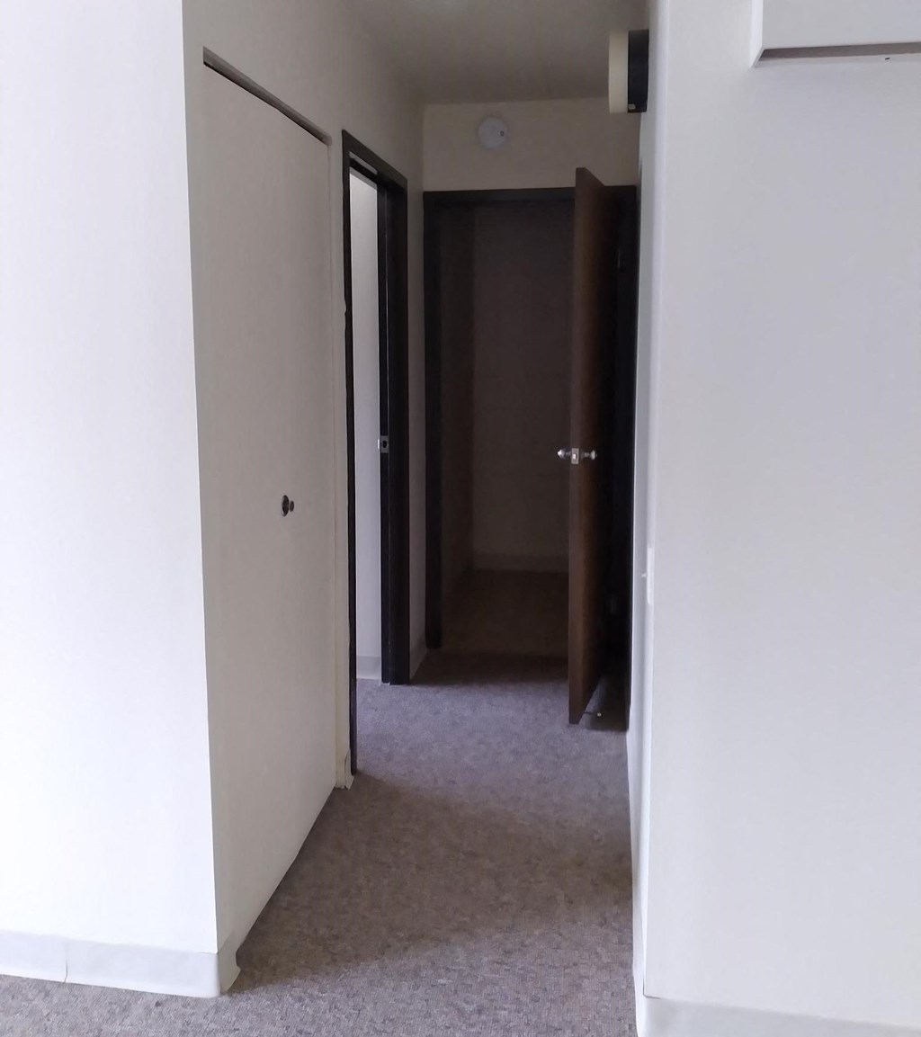 a view of the hallway from the living room