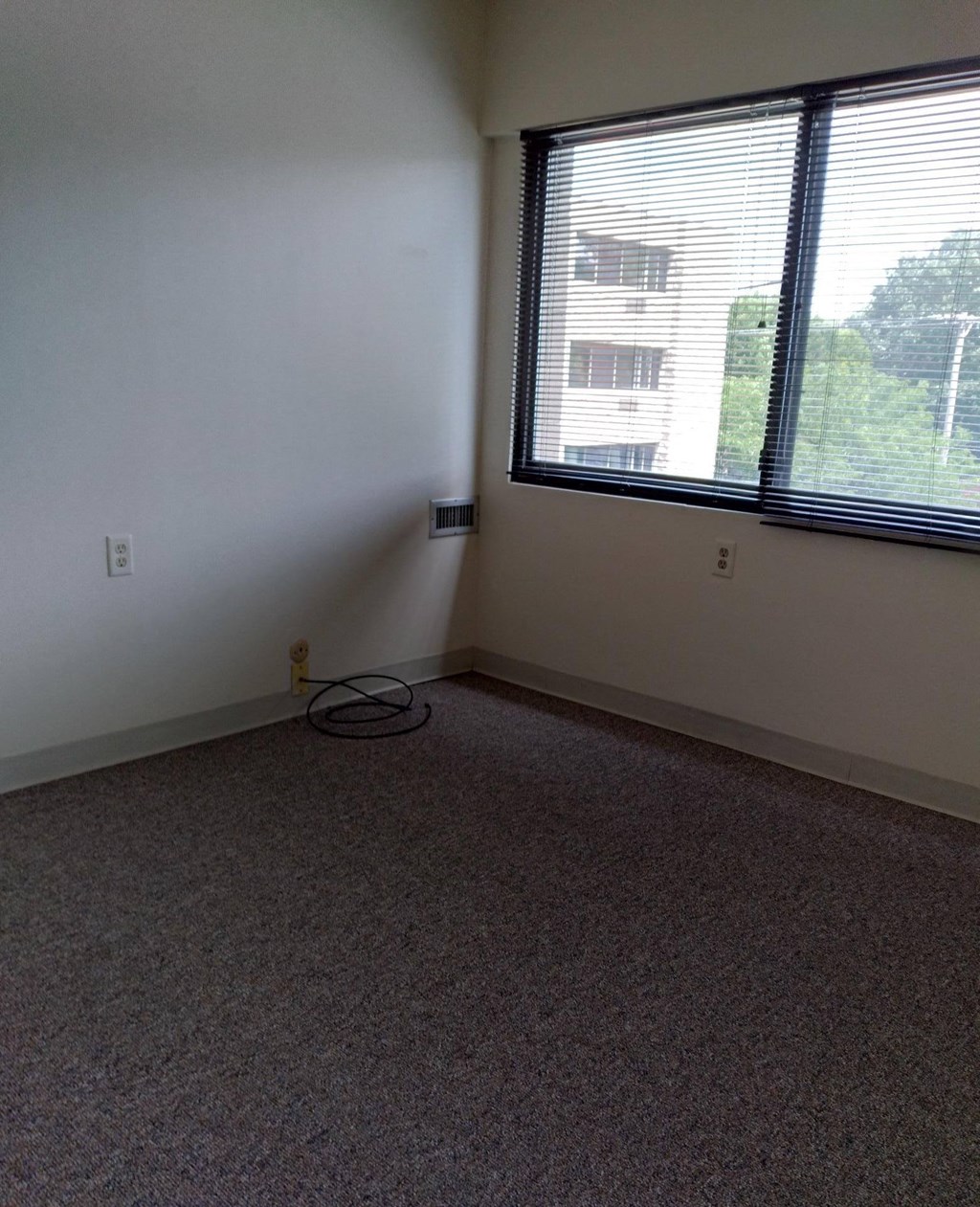 an empty room with a large window