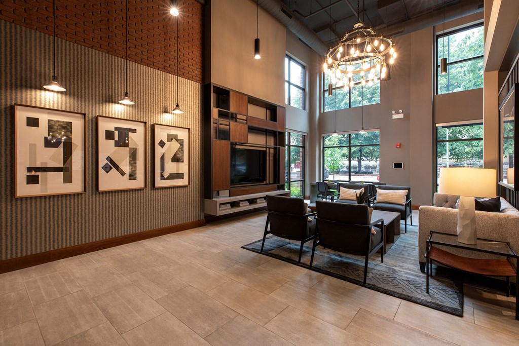 a living room with a table and chairs and a fireplace