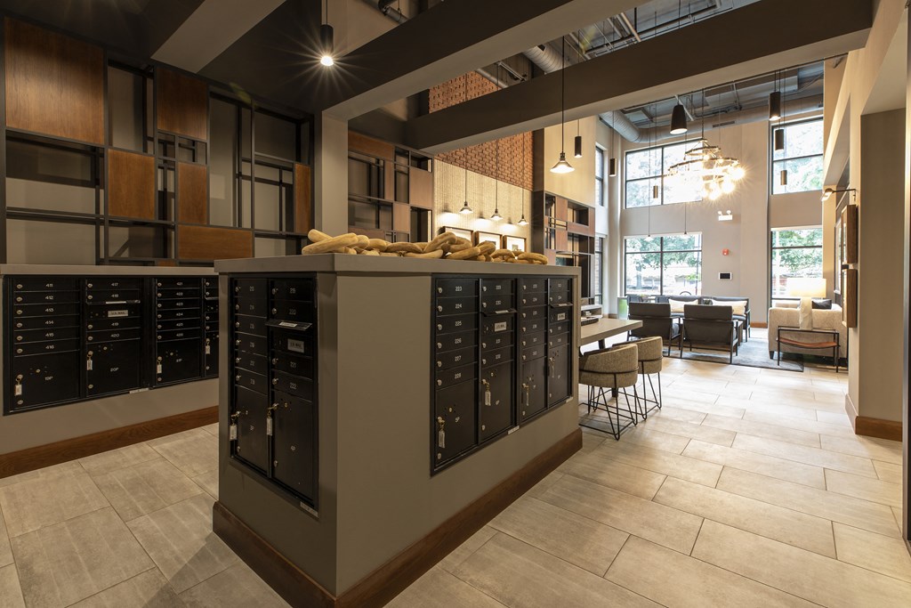 a tasting room with a counter filled with wine bottles and a table with chairs