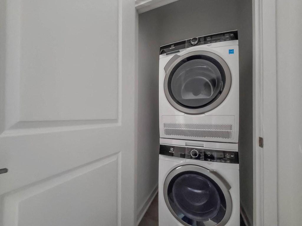a front loading washer and dryer in a laundry room
