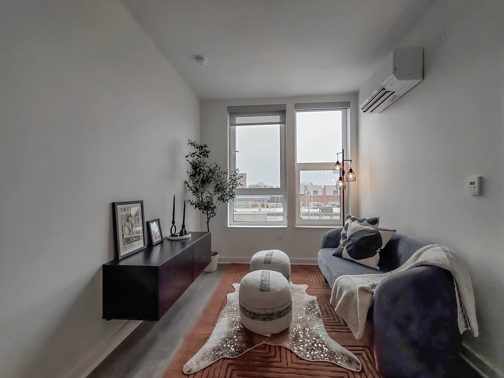 a living room with a couch and a window