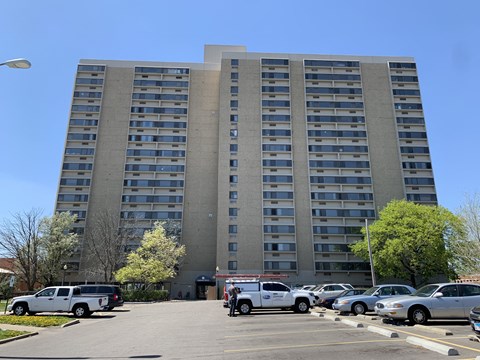 a parking lot in front of an apartment building