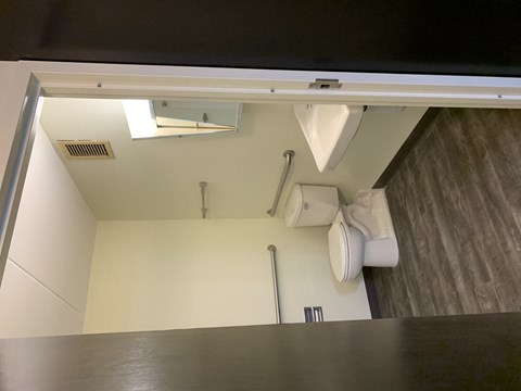 an overhead view of a bathroom with a sink and toilet