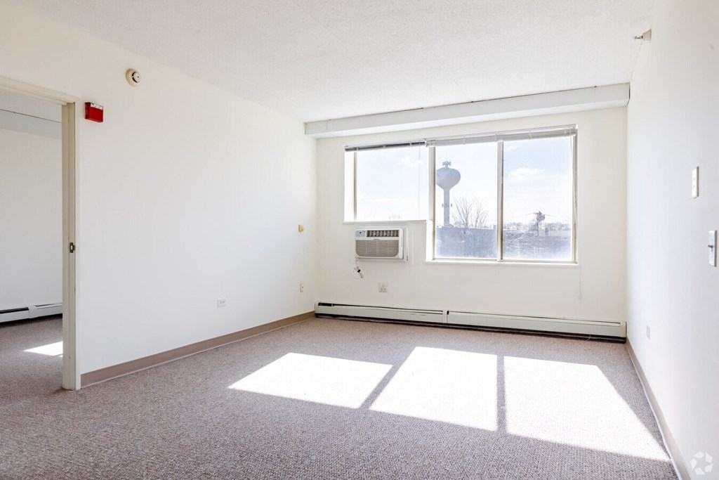 A room with a window and a door.