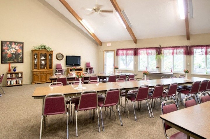 a large room with tables and chairs