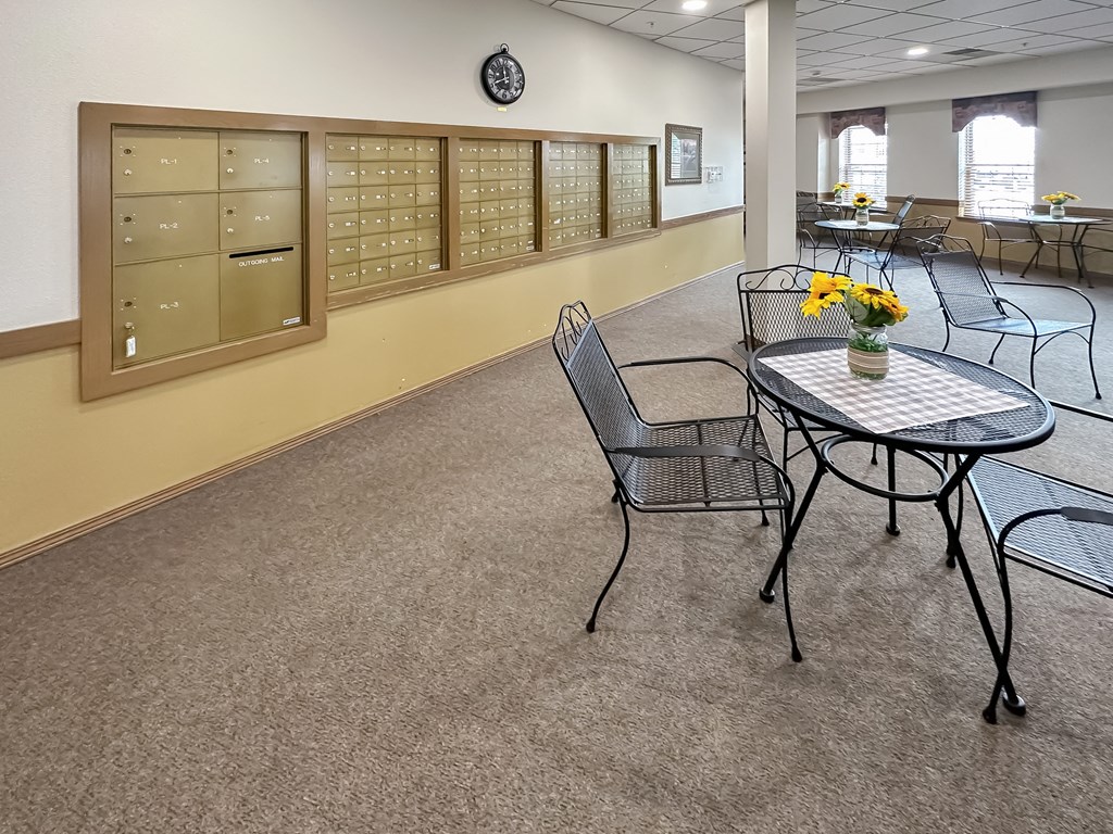 a dining room with tables and chairs and a bulletin board