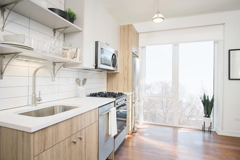 a kitchen with a sink and a window