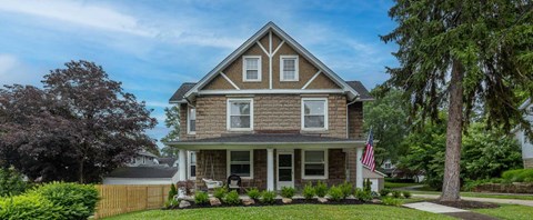 a house with an american flag in front of it