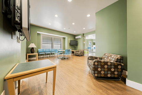 Student lounge with seating and TVs.