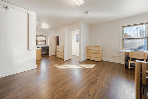 A room with wooden floors and white walls.