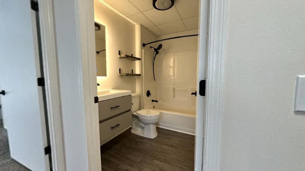 a bathroom with a toilet sink and bathtub