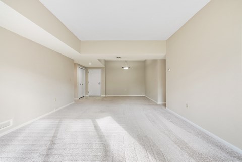 Open concept living space with vaulted ceiling at Atrium in The Village Apartments, Beachwood, 44122