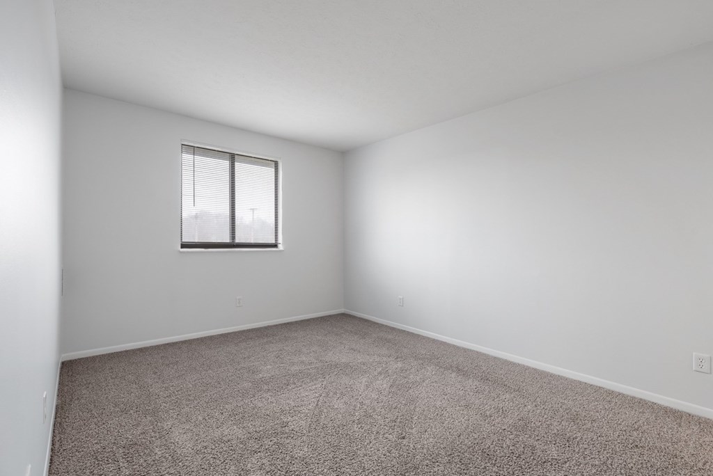 Carpeted bedroom with window at Integrity Medina Apartments, Medina, 44256