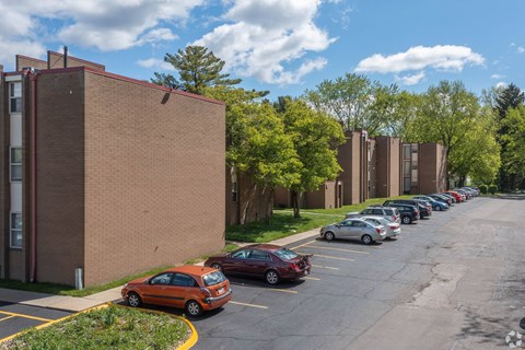 Modern buildings with ample parking at Eagles Landing Apartments, Integrity Realty, Ohio