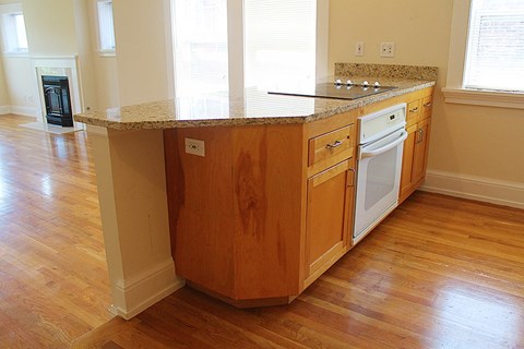 a kitchen with a granite counter top and a stove