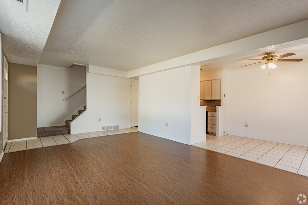 Living room with plank flooring at Huntington Hills Townhomes, Integrity Realty, Stow, OH