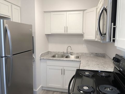 Left side of renovated kitchen at Eagles Landing Apartments, Integrity Realty, Kent, OH