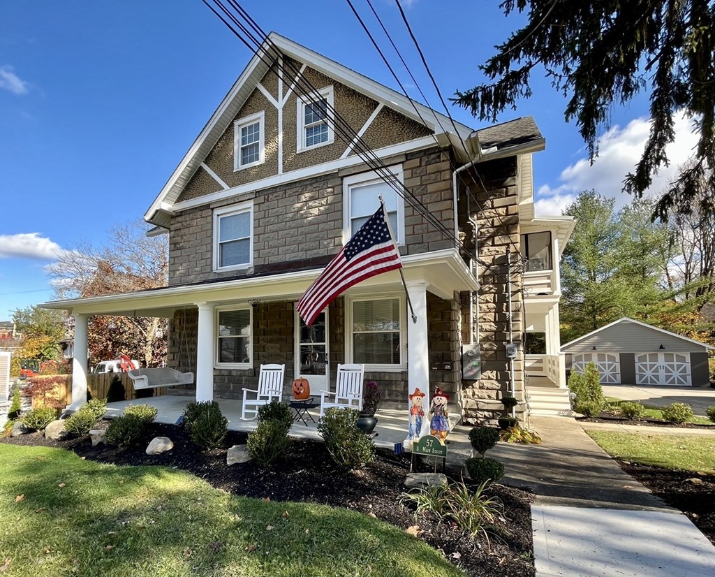 a home with an flag on the front porch