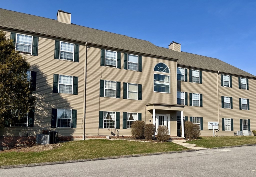 a large building with a blue sky in the background