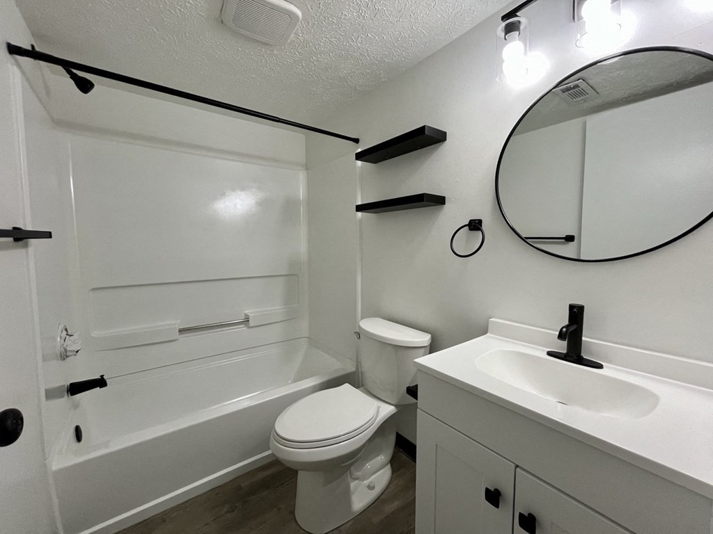 a bathroom with a sink toilet and a tub at Renova of Brunswick, Brunswick 