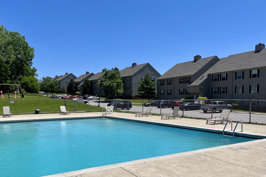 a swimming pool with a building in the background at Renova of Brunswick, Brunswick 