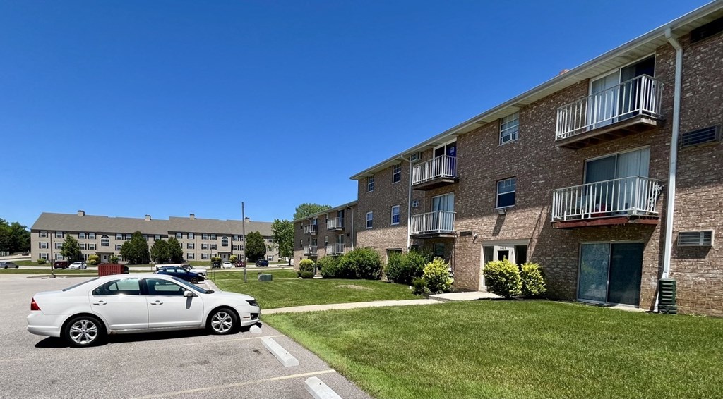 a car parked in a parking lot in front of an apartment building at Renova of Brunswick, Brunswick Ohio 