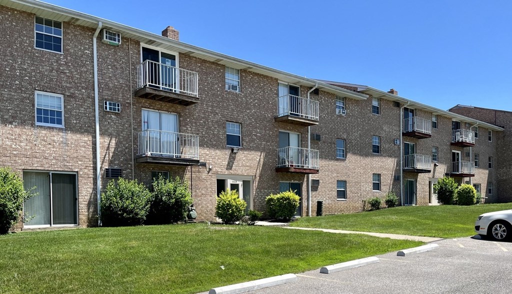 a brick apartment building with balconies at Renova of Brunswick, Brunswick, 44212 