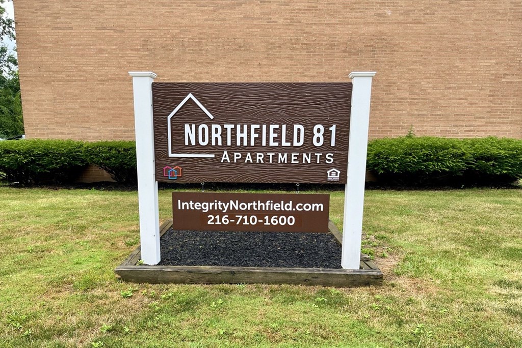 a sign for northfield 81 apartments in front of a building