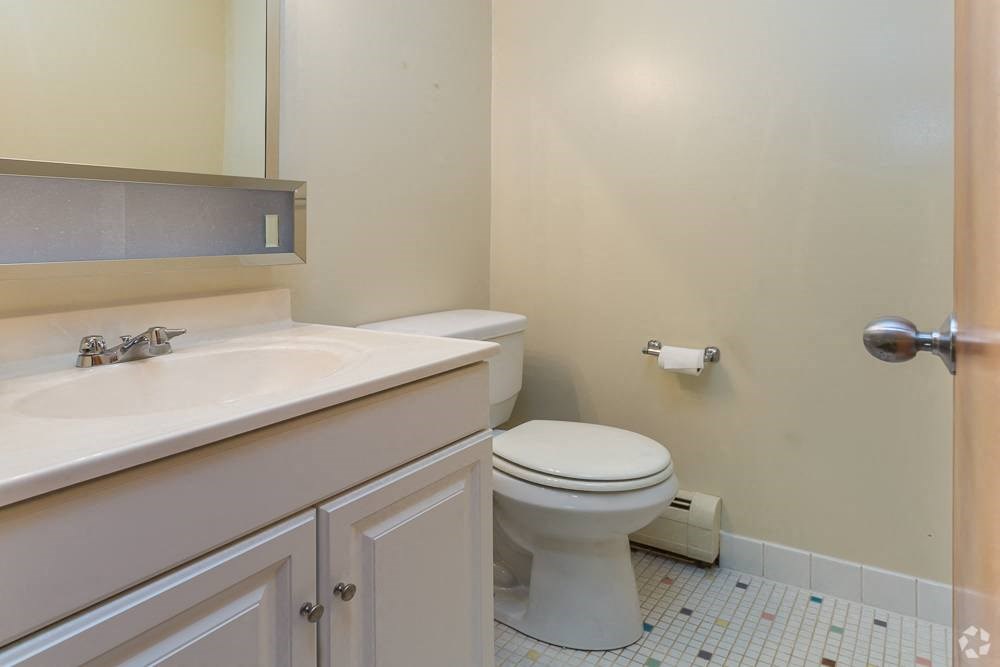 a bathroom with a toilet and a sink