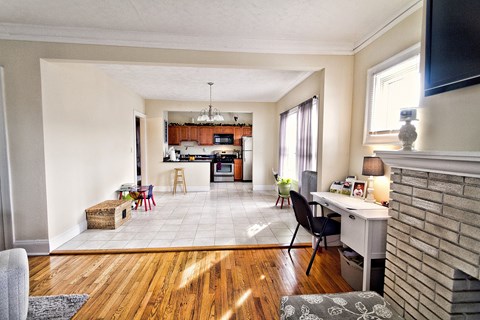 the living room and kitchen of a small apartment