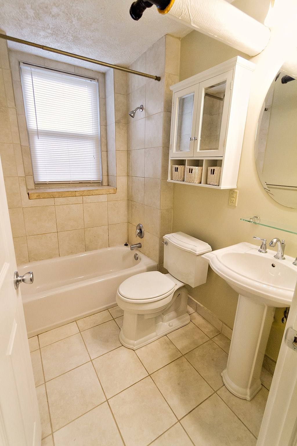 a bathroom with a sink toilet and a bath tub
