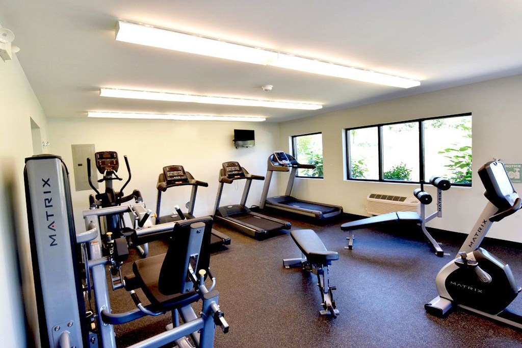 On-site fitness center with a variety of equipment at Integrity Medina Apartments, Medina, OH,  44256