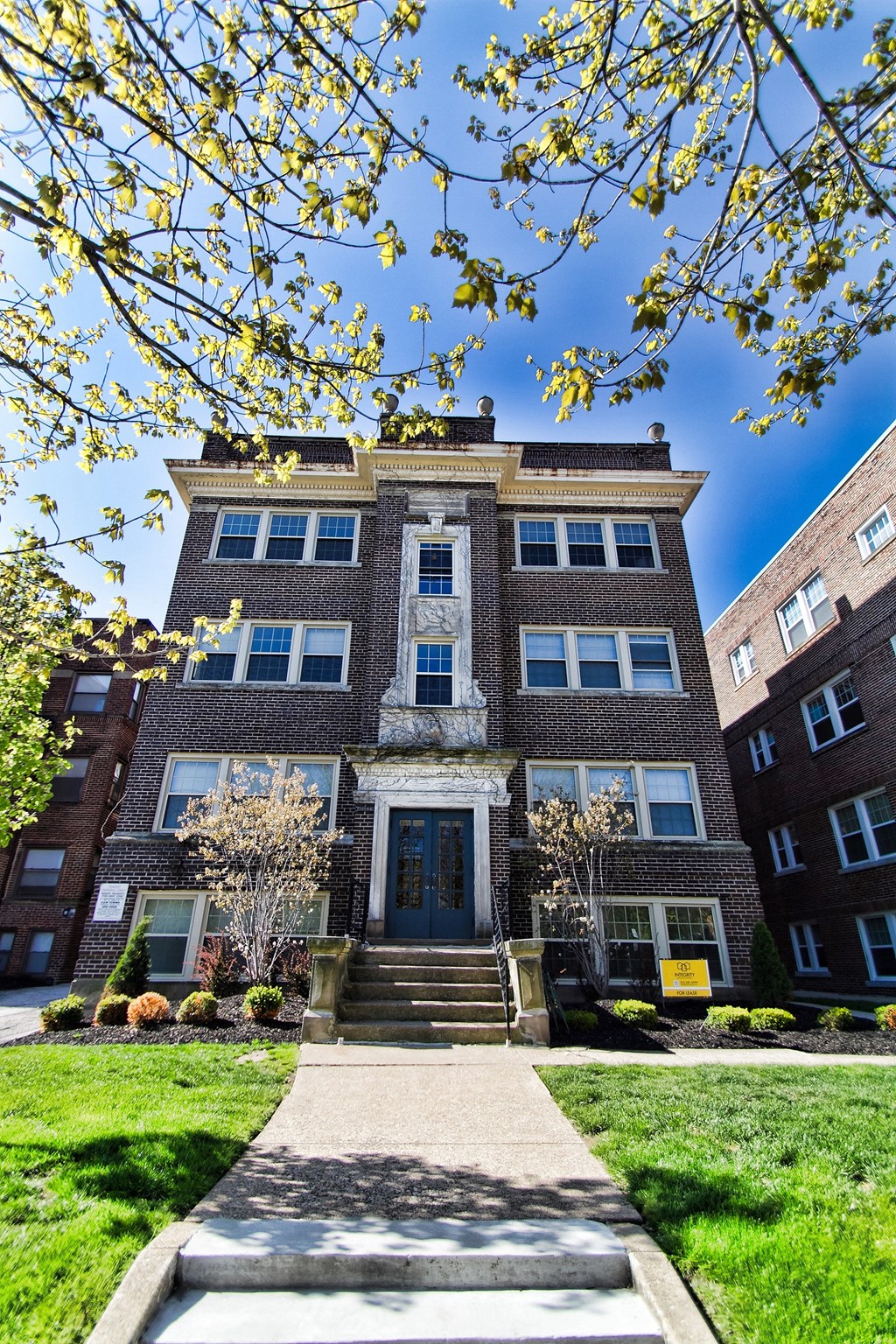 a brick building with a blue sky in the background