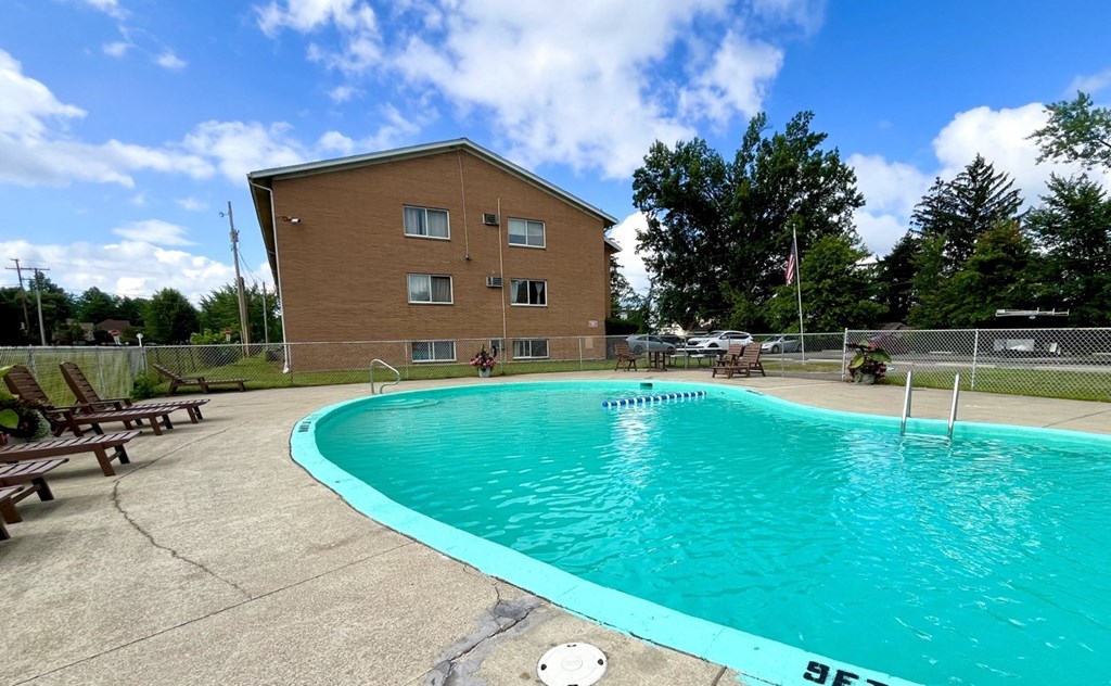 the swimming pool at our community center with our building in the background