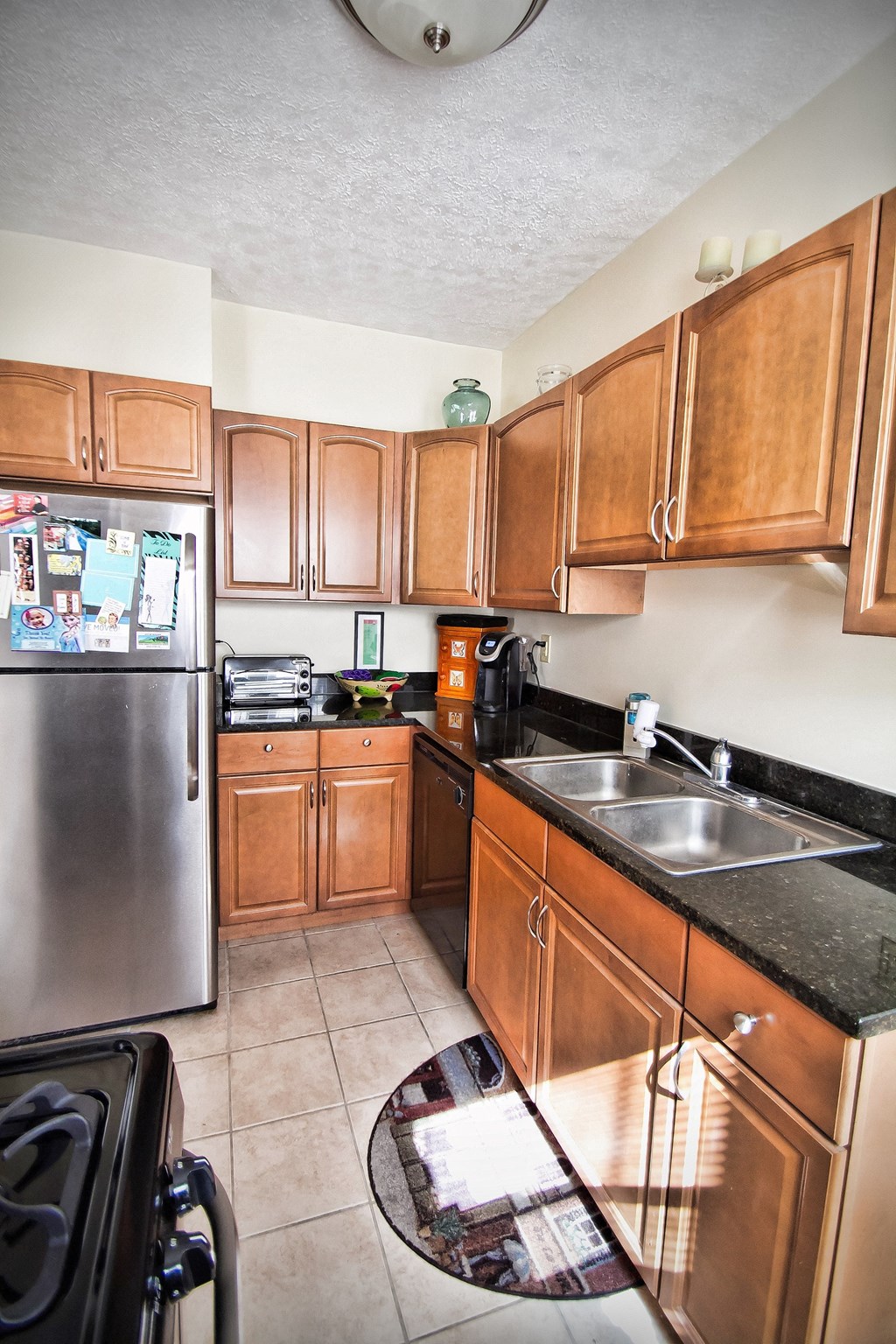 Kitchen with Stainless Steel Appliances at Integrity Gold Coast Apartments in Lakewood, Ohio, 44102