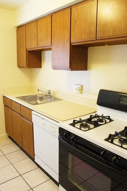 a kitchen with a stove and a sink