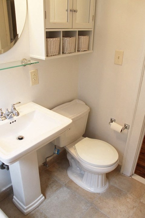 a bathroom with a toilet and a sink