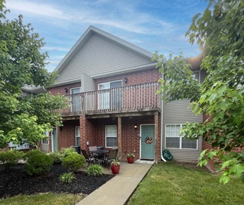 Front of a house with a green space