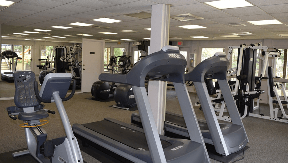 Community fitness center with gym equipment and machines.at Atrium in The Village, Ohio, 44122