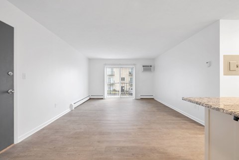 Spacious living room with patio/balcony sliding door.